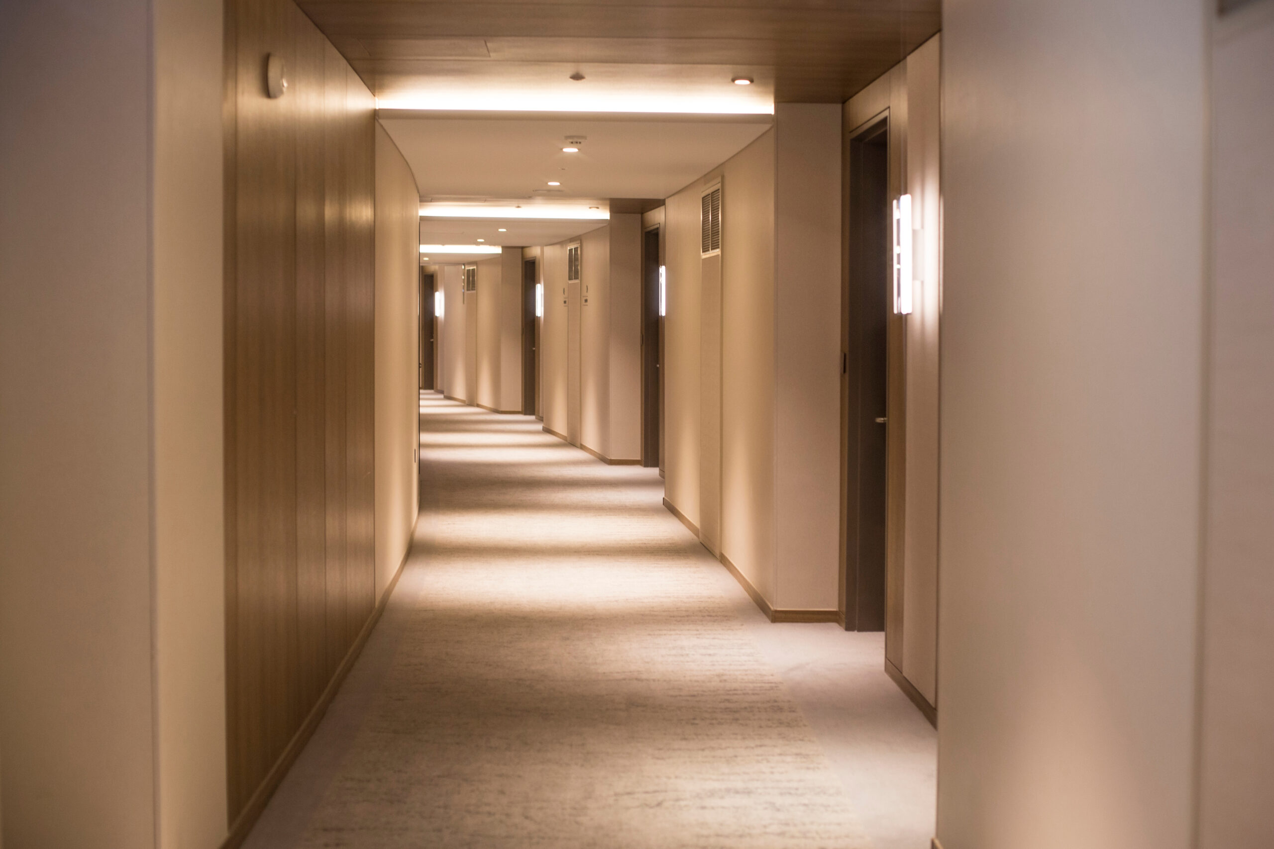 Modern hospitality corridor representing enterprise mobile communication and Ascom VoWiFi solutions for hotels and large facilities